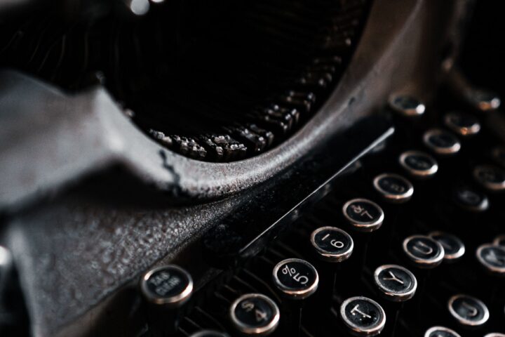 Close-up of a vintage typewriter in dramatic light