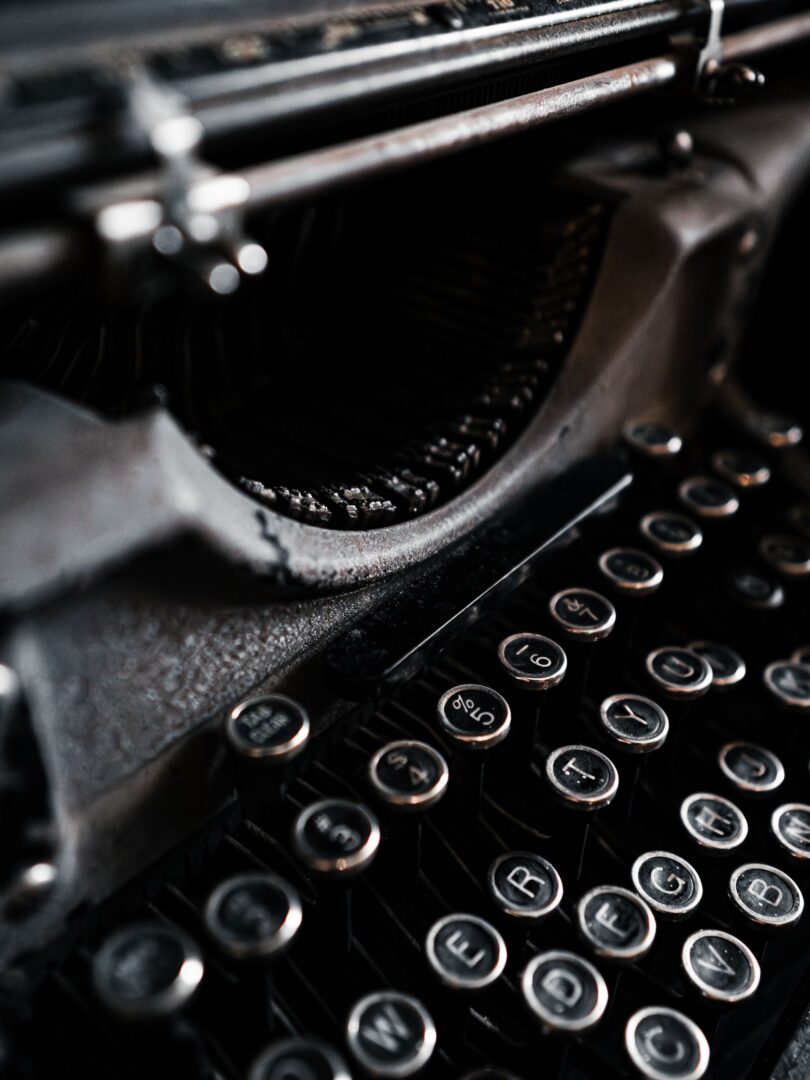 Close-up of a vintage typewriter in dramatic light